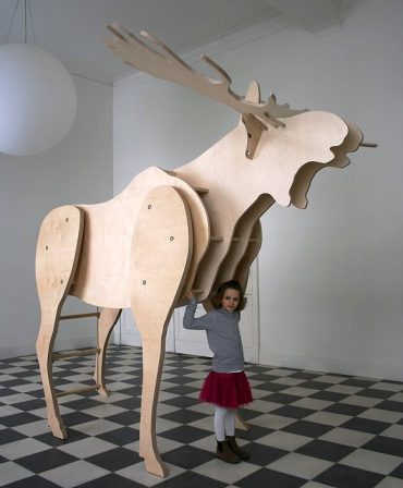 Father Moose, a 9ft tall moose with bookshelves and a place for kids to read, hide, and sleep.